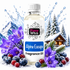 A bottle of Fizzy Whiz Alpine Escape Fragrance Oil centered in a snowy winter scene with mountains, a cabin, water splash, purple flowers, blueberries, and raspberries.