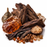 A styled arrangement of natural ingredients on a white background, including dark brown wood pieces, amber-colored resin chunks, a small bowl of translucent crystals, and a brass incense burner.