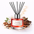 Red diffuser bottle labeled 'Ancient Ayurveda' with black sticks on a white background.
