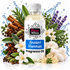 A bottle of Fizzy Whiz Ancient Hammam Fragrance Oil centered against a white background, surrounded by decorative ingredients and water splashes including cinnamon sticks, star anise, rosemary, lavender, white flowers, green leaves, cotton, and crystals.