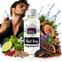 A bottle of Fizzy Whiz Bad Boy Fragrance Oil centered in front of a man spraying fragrance oil on his neck. The bottle is white with a black and pink label.