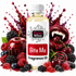 A bottle of Fizzy Whiz Bite Me Fragrance Oil centered against a white background, surrounded by glossy red and purple fruit, berries, a vampire mouth graphic, and red liquid splashes. The bottle label reads 'Fizzy Whiz' and 'Bite Me Fragrance Oil.