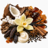 A styled botanical arrangement of natural ingredients on a white background, including a halved coconut, white coconut pieces, a pale vanilla orchid flower, vanilla beans, cinnamon sticks, star anise, cloves, brown sugar crystals, amber sugar pieces, and dark brown spices.