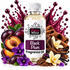 A bottle of Fizzy Whiz Black Plum Fragrance Oil centered against a white background, surrounded by plums, purple flowers, vanilla orchids, cocoa powder, and a brown cloth, with a dark plum splatter graphic behind it.