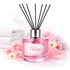 Pink diffuser labeled 'Bliss' with floral decorations on a white background