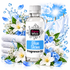 A bottle of Fizzy Whiz Blue Skies Fragrance Oil centered against a bright blue sky and clouds background, surrounded by folded white towels, white flowers, blue blossoms, leaves, water droplets, and hanging white clothes.
