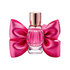 Pink glass perfume bottle with a decorative satin bow on each side and a metallic pink cap, displayed upright on a light background.