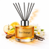 Reed diffuser labeled 'Bos Orange' with orange slices, apples, and flowers on a white background
