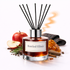 Bottled Elixir Reed Diffuser Oil with apple, spices on white background