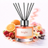 Reed diffuser labeled 'Bright' with fruits, flowers, and spices on a white background