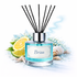 Reed diffuser labeled 'Brisa' with lemons, lime, and a shell on a white background