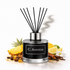 C. Aventos diffuser with pineapple, lemon, and cinnamon on a white background