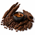 A black ceramic cup filled with steaming coffee sits on a white background, surrounded by roasted coffee beans and dark brown wood slices.
