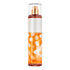 Spray bottle with white polka dots on an orange background
