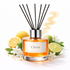 Reed diffuser labeled 'Citrus' with lemons, limes, and flowers on a white background