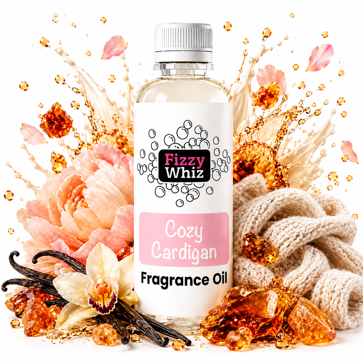 A bottle of Fizzy Whiz Cozy Cardigan Fragrance Oil centered on a white background, surrounded by decorative scent-themed props including peach flowers, vanilla beans, amber crystals, and a beige knit scarf. The bottle label is white with pink and black text.