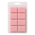 Pink wax melts in a clear plastic packaging on a white background