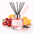 Diffuser with cranberry and orange theme on a white background