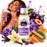 A bottle of Fizzy Whiz Delicia Drench fragrance oil centered on a white background, surrounded by purple flowers, plums, vanilla beans, cinnamon sticks, honey, and a woman holding a spray bottle.