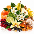 A styled botanical still life of assorted citrus fruits, pears, vanilla beans, red berries, amber crystals, wood bark, and white flowers arranged together on a clean white background.