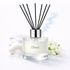 Dove diffuser with black reeds and a white background