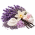 Lavender-themed cosmetic or fragrance ingredients arranged on a white background, including a swirl of white cream, lavender buds, vanilla beans, a white orchid flower, and pink and white marshmallows.