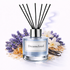 Diffuser with 'Dreamcloud' label surrounded by lavender and vanilla beans on a white background