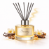 Diffuser bottle labeled 'Dreamy' with black sticks on a white background