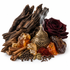 A styled arrangement of natural ingredients and a brass incense burner on a white background, including dark wood bark, cinnamon sticks, amber crystals, cloves, cardamom pods, red spice, and a deep burgundy rose.