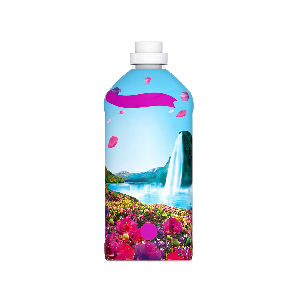 A bottle with an Enchanted Wildflower theme, featuring an illustration of a field with wildflowers and a waterfall in the background.