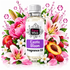 A bottle of Fizzy Whiz Exotic Bloom Fragrance Oil centered on a white background, surrounded by pink flowers, green leaves, strawberries, raspberries, and peach slices with water droplets. The bottle has a white cap and a white label with pink and purple text.