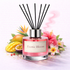 Pink diffuser bottle labeled 'Exotic Bloom' with floral and fruit elements on a light background