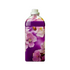 Tall purple plastic bottle with a grey cap, wrapped in an all-over exotic floral design featuring pink and lavender blossoms on a deep purple background, shown on a plain light background.