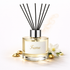 Reed diffuser labeled 'Fame' with black reeds and a white label on a light background.