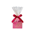 Small pink gift box wrapped in clear cellophane, tied with a deep red ribbon bow, featuring decorative swirl and star patterns, shown upright on a light background.