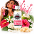 A bottle of Fizzy Whiz Flor Mistic fragrance oil is centered against a white background, surrounded by tropical flowers, green leaves, a coconut half, and a woman holding a pink spray bottle. Pink liquid splashes and droplets decorate the scene.
