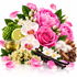 Flower Bomb fragrance oil scent notes featuring pink peonies and roses, white orchids, jasmine, bergamot, green tea, vanilla pods and warm woody notes on a clean white background.