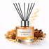 Frankincense & Myrrh Reed Diffuser Oil in a clear bottle and orange oil surrounding with spices on a white background 