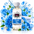 A bottle of Fizzy Whiz Fresh Sky Fragrance Oil centered on a white background, surrounded by blue flowers, blue water splashes, folded white towels, and glossy blue droplets. The bottle has a white cap and a white label with blue and black text.