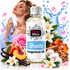 A bottle of Fizzy Whiz Ghosts Fragrance Oil centered in a stylized commercial composition. The bottle has a white label with blue and black text and a silver cap.