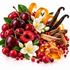 A styled fruit and spice arrangement on a white background, featuring dark red cherries, sliced red fruit, white flowers, orange peel curls, vanilla beans, cinnamon sticks, amber resin, and small red berries.