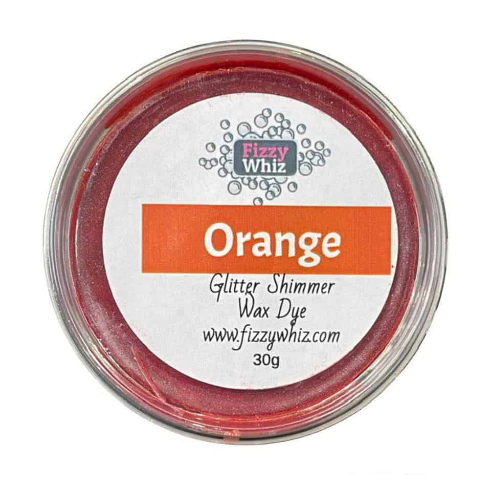 A pot of orange glitter shimmer wax dye from Fizzy Whiz, with label showing the brand and product name.
