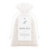 Bag of bath tea with a label on a white background