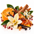 A styled still life of orange slices, vanilla beans, amber crystals, white flowers, green leaves, and red berries on a clean white background.