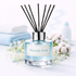 Reed diffuser labeled 'Heavenly Fresh' with black reeds on a light background.
