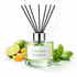 Diffuser bottle labeled 'Lime Basil Mandarin' with lime, orange, and basil on a white background