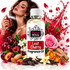 A bottle of Fizzy Whiz 'Lost Cherry' fragrance oil centered in a highly styled commercial composition. The bottle is surrounded by cherry blossoms, cherries, almonds, vanilla beans, cinnamon, and a red liquid splash graphic on a white background.