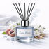 Reed diffuser labeled 'Luna Moon' with decorative elements on a white background