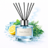 Reed diffuser labeled 'Luna Ocean' with lemon, ice cubes, and greenery on a light background