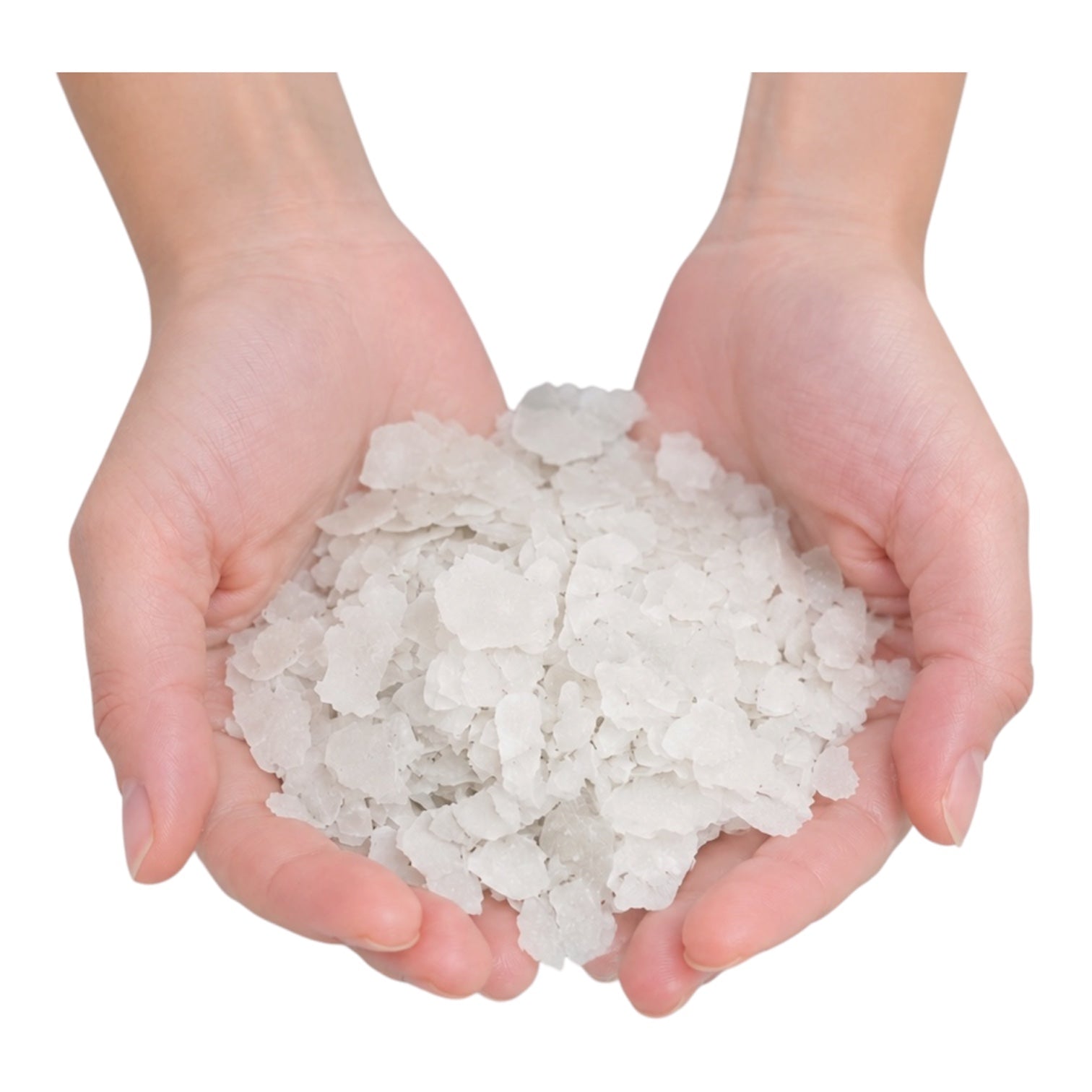 Two hands holding a pile of white sea salt crystals on a white background
